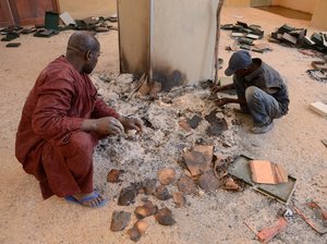 Men recover burned ancient manuscripts at the Ahmed Baba Centre for Documentation and Research in Timbuktu, Mali, on Jan. 29, 2013. Islamists torched the building, which housed thousands of the manuscripts, and destroyed mausoleums and monuments in the city. Eric Feferberg/AFP/Getty Images