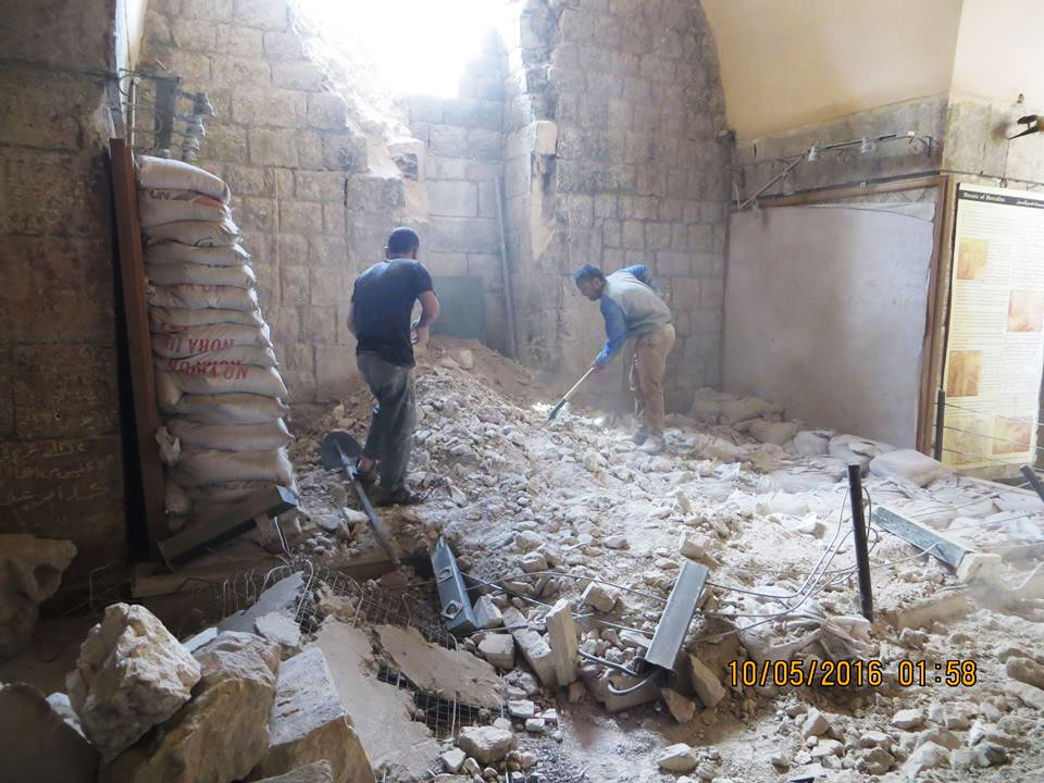 The DayAfter Heritage Protection Initiative. TDA-HPI. The mosaic museum in Ma’arrat al-Numan, northwestern Syria, following an airstrike by the Syrian government in May 2016; mosaics at left were protected by a wall of sandbags